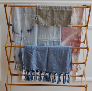  Turkish Towels hanging to dry on a drying rack 